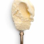 A spoonful of sweet cream ice cream.