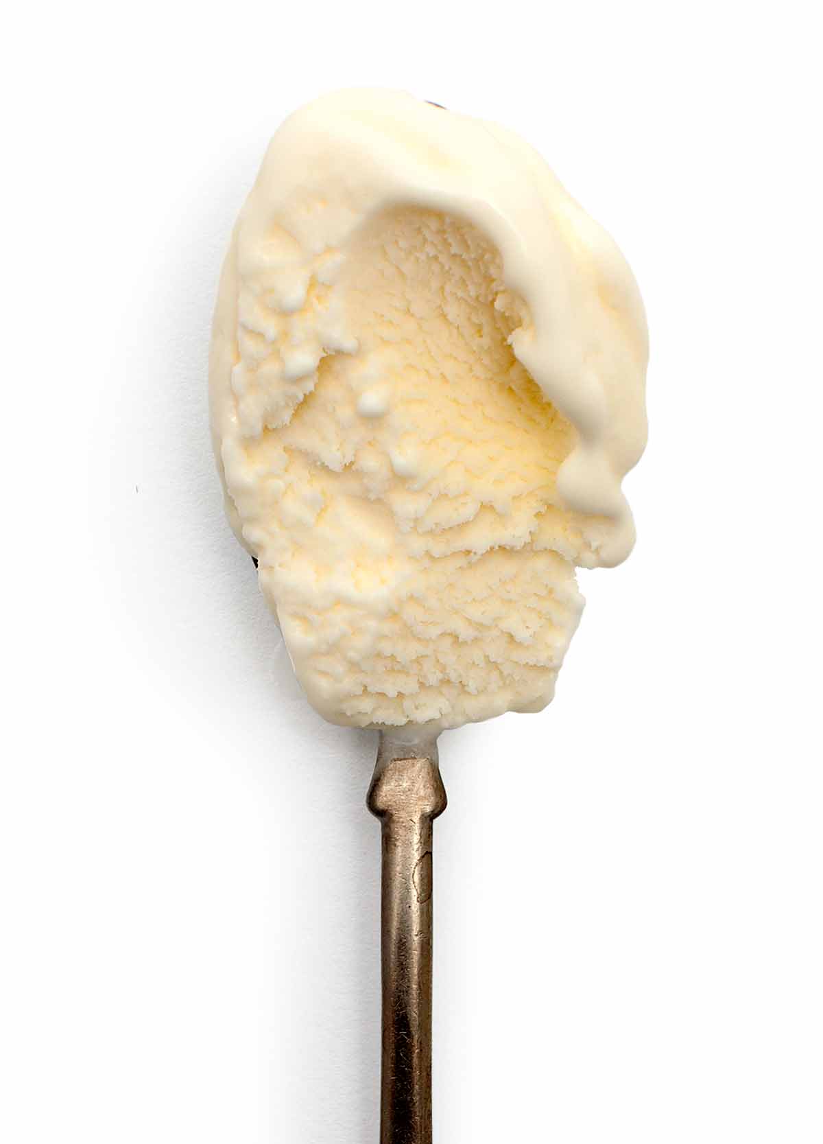 A spoonful of sweet cream ice cream.