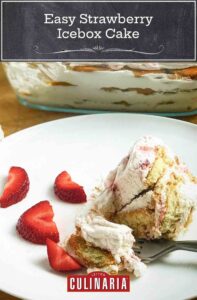 A scoop of easy strawberry icebox cake on a white plate with sliced strawberries and a glass baking dish with the rest of the cake beside it.