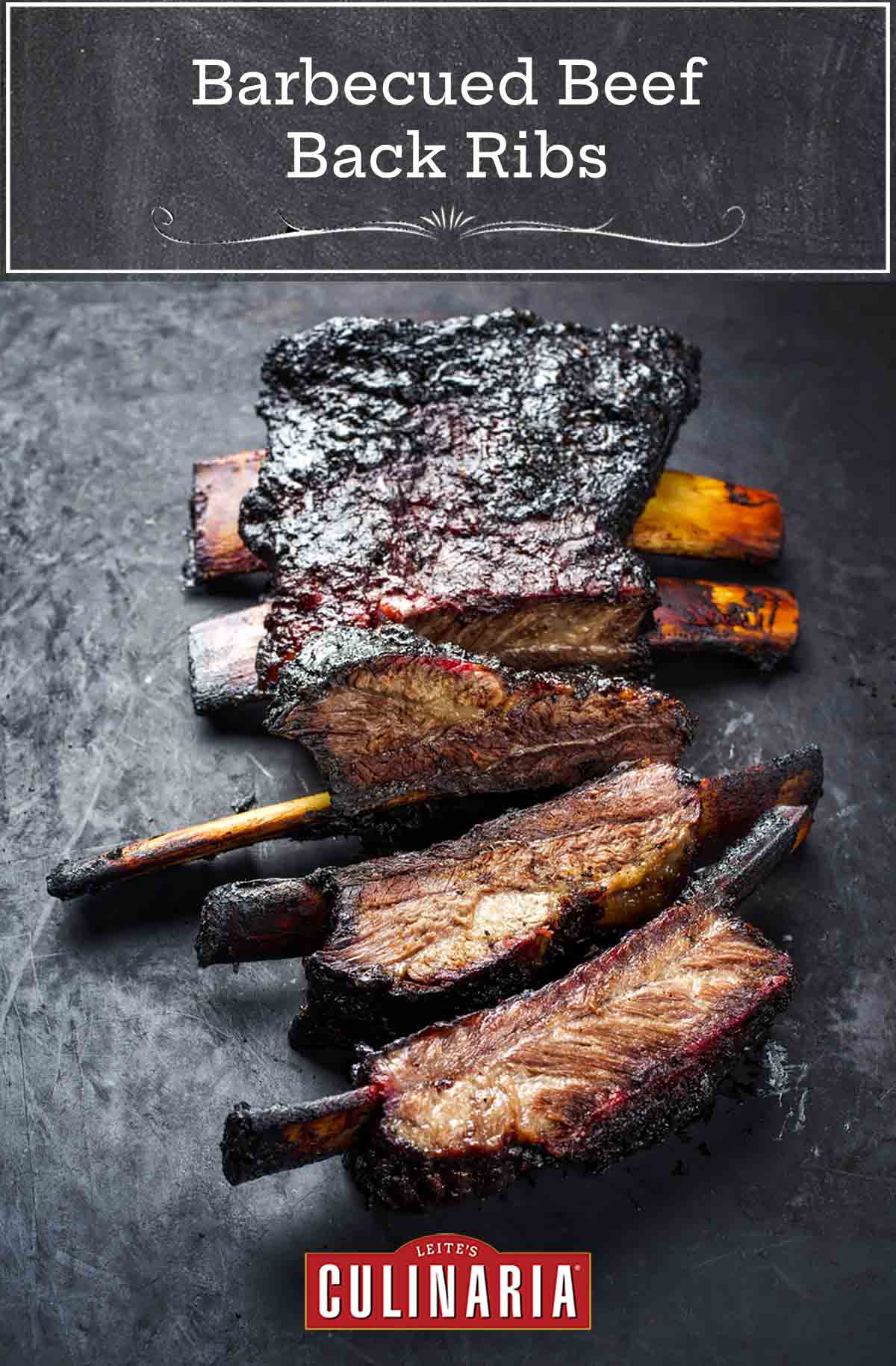 A slab of barbecued beef back ribs cut into individual ribs.