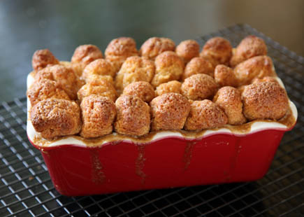 A pan of baked monkey brad on a wire rack.