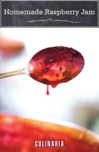 A spoon with raspberry jam dripping off of it.