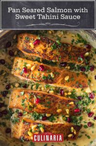 Four pieces of pan seared salmon in a sweet tahini sauce, topped with pomegranate and pine nuts.
