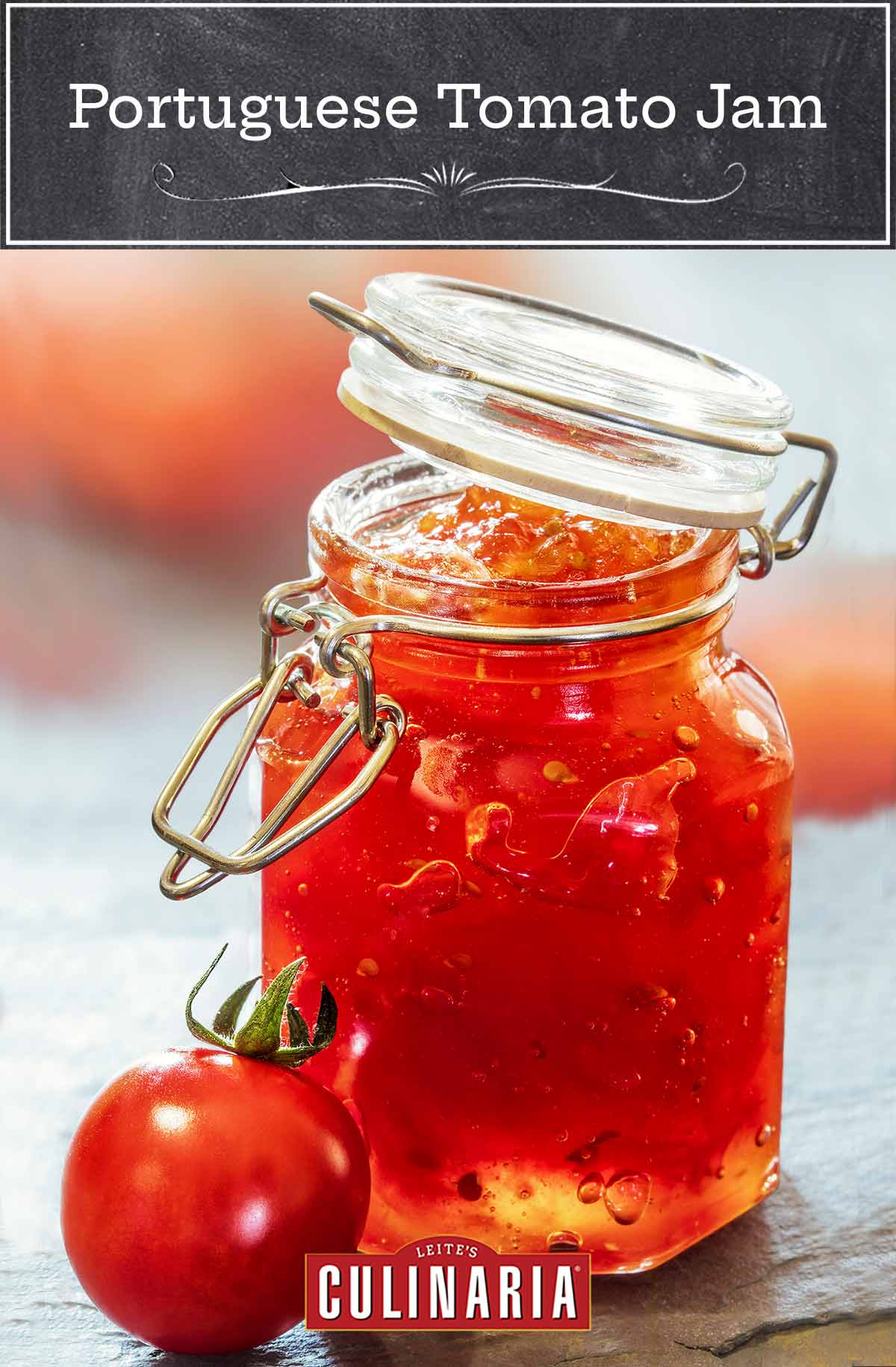 A jar of Portuguese tomato jelly with a small tomato next to it.