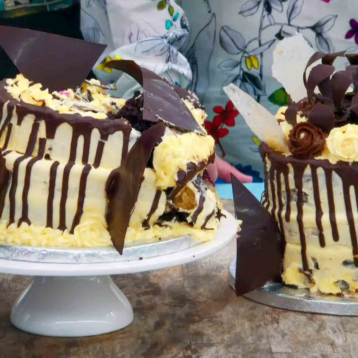 Two topple cakes in the Great British Bake Off competition judged by Paiul Hollywood.