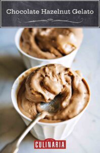 Two cups with scoops of chocolate hazelnut gelato, known as gelato di gianduia, with a spoon.