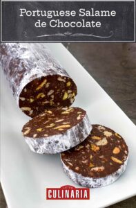 A log of chocolate salami with two slices cut from the end on a white rectangular platter.