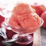 A few scoops of apple sorbet in a glass dish.