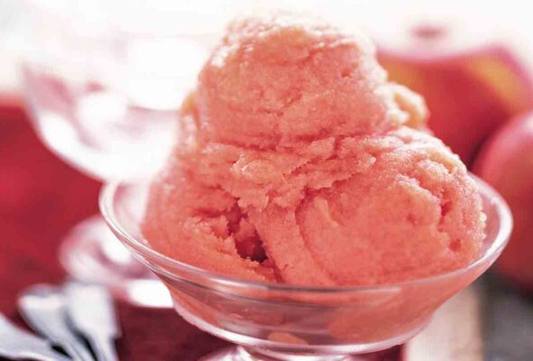 A few scoops of apple sorbet in a glass dish.