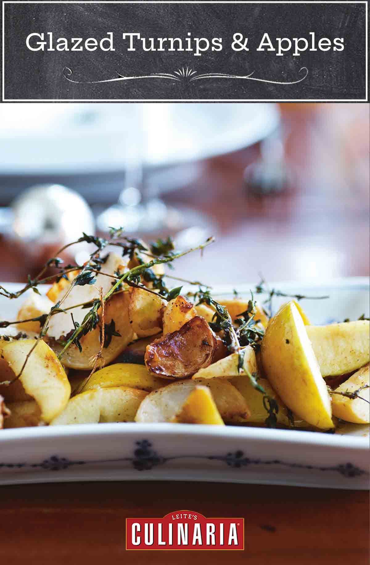 A white platter filled with turnip and apples segments, topped with thyme sprigs.