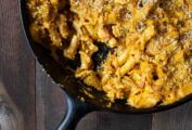 A cast-iron skillet filled with pumpkin macaroni and cheese.