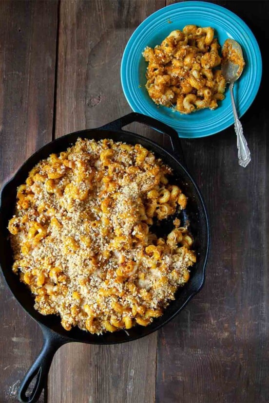 A cast-iron skillet filled with pumpkin macaroni and cheese.