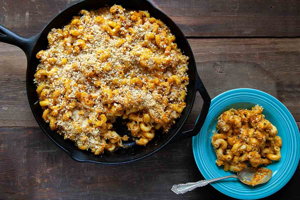 A cast-iron skillet filled with pumpkin macaroni and cheese.