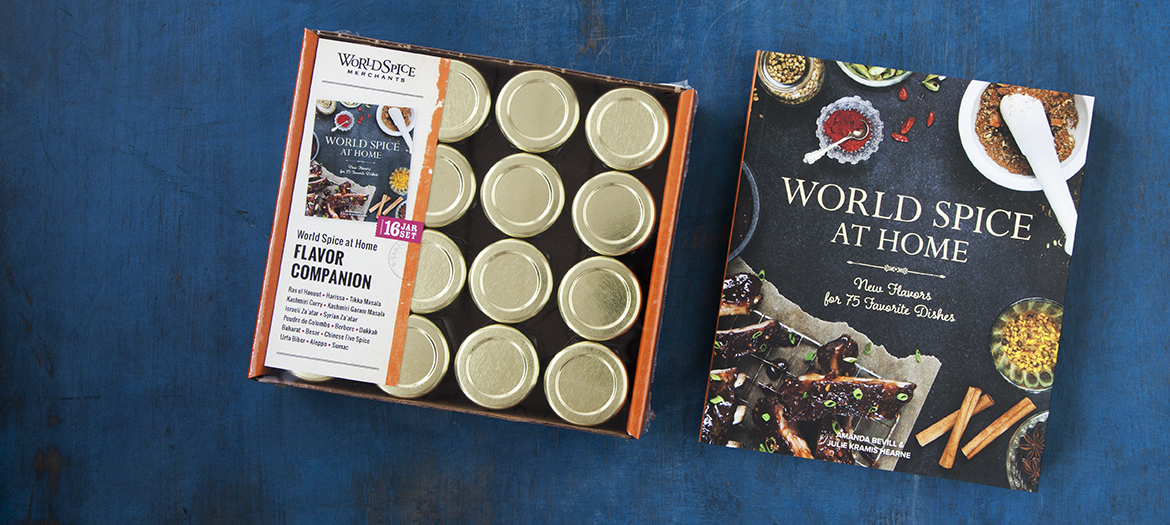 A photo of World Spice at Home Gift Set and the Flavor Companion Cookbook side by side on a dark blue background.