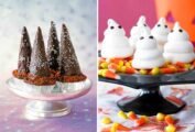 Four wizard hats cupcakes on a cake stand and five meringue ghosts on top of a pile of candy corn on a black cake stand.
