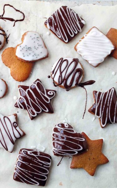 Assorted shaped lebkuchen decorated with white and chocolate icing.