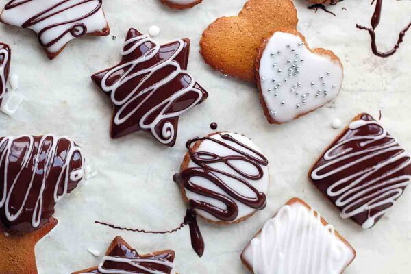 Assorted shaped lebkuchen decorated with white and chocolate icing.