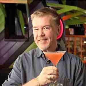 A man holding a cocktail.