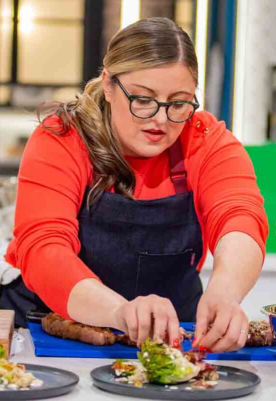 A woman on a cooking competition.