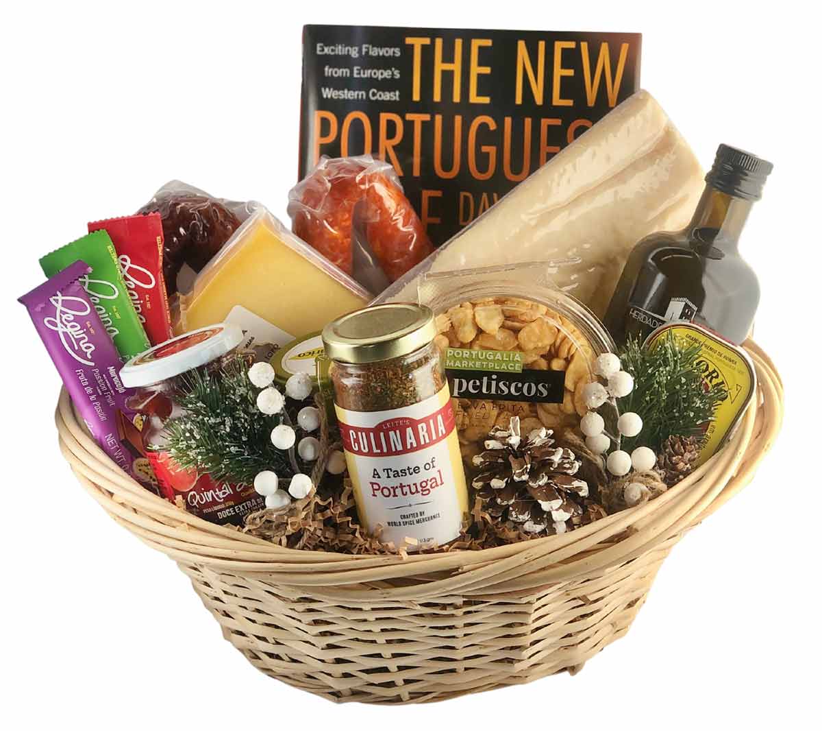 A wicker basket with spices, cheese, olive oil, chocolates, and a cookbook.