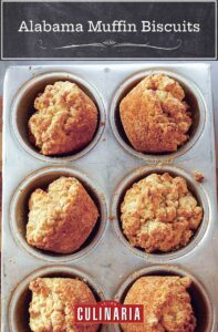 Six Alabama muffin biscuits in a muffin tin.