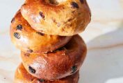 A stack of four cinnamon raisin bagels.