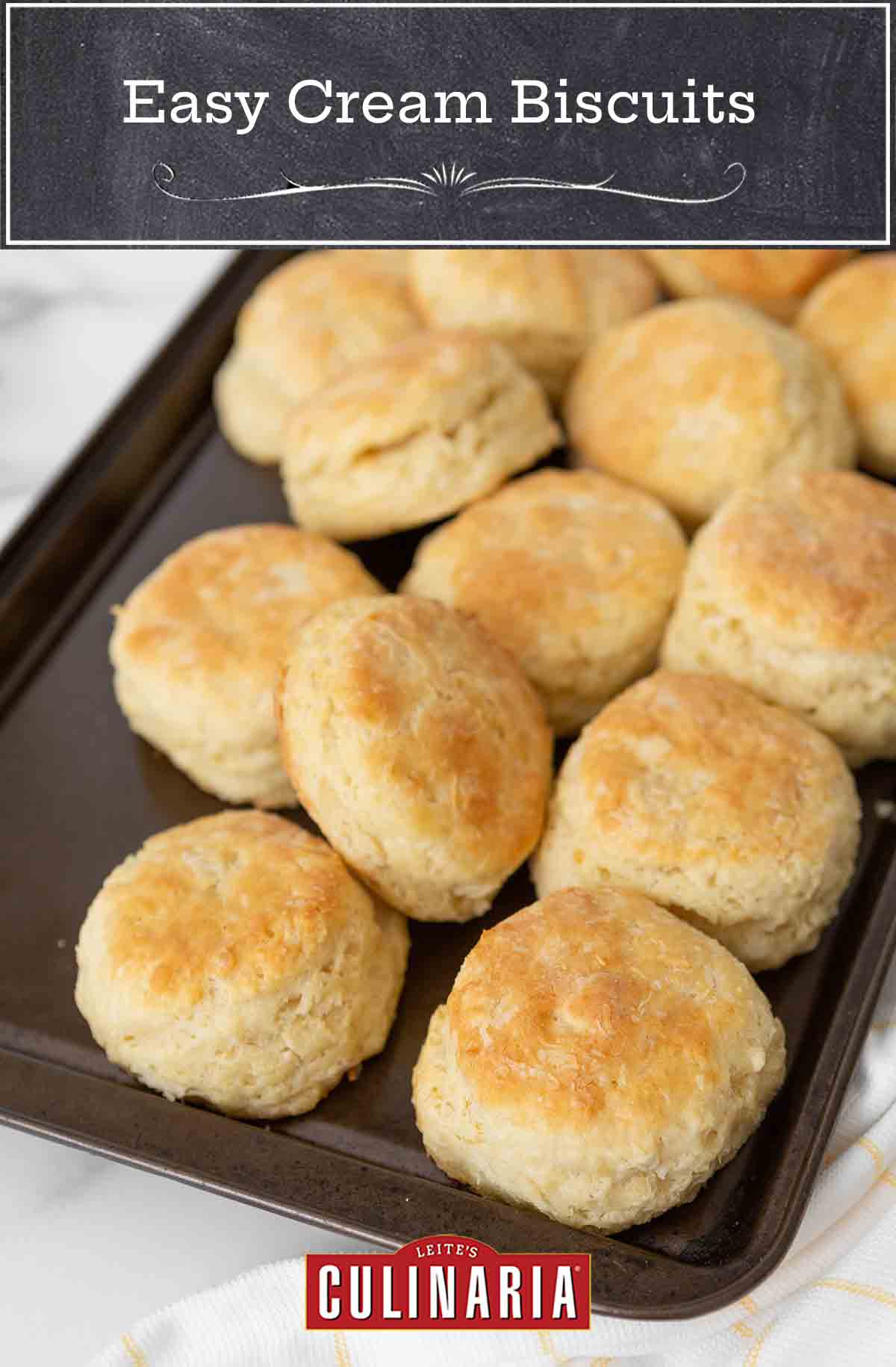 A baking sheet filled with cooked biscuits.