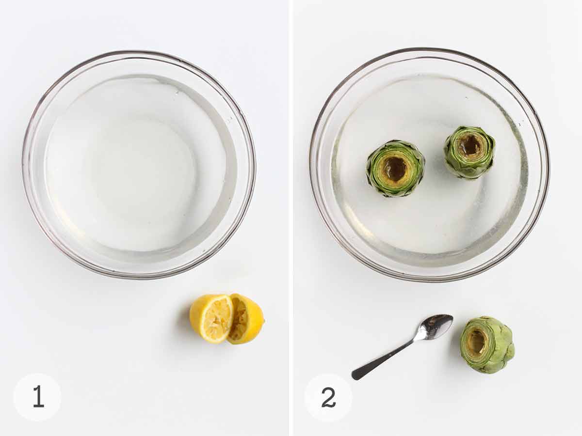 En skål med citronvatten med en halverad citron på sidan och två kronärtskockor i en skål med citronvatten med en enda kronärtskocka bredvid en sked.
