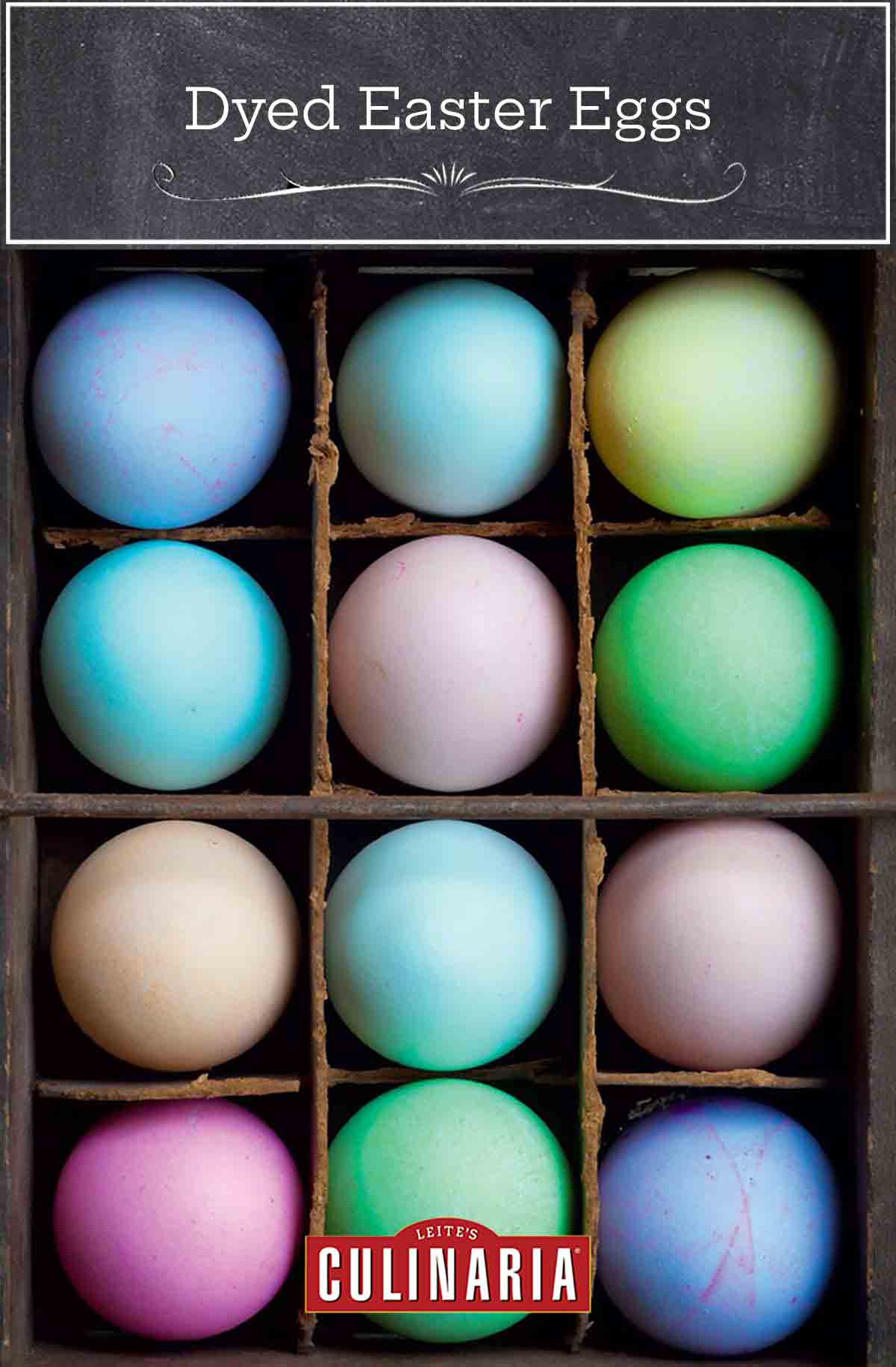 A crate filled with an assortment of dyed easter eggs.