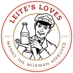A badge with a milkman pointing to a milk bottle. It reads, "Leite's Loves, Manny the Milkman Approved."