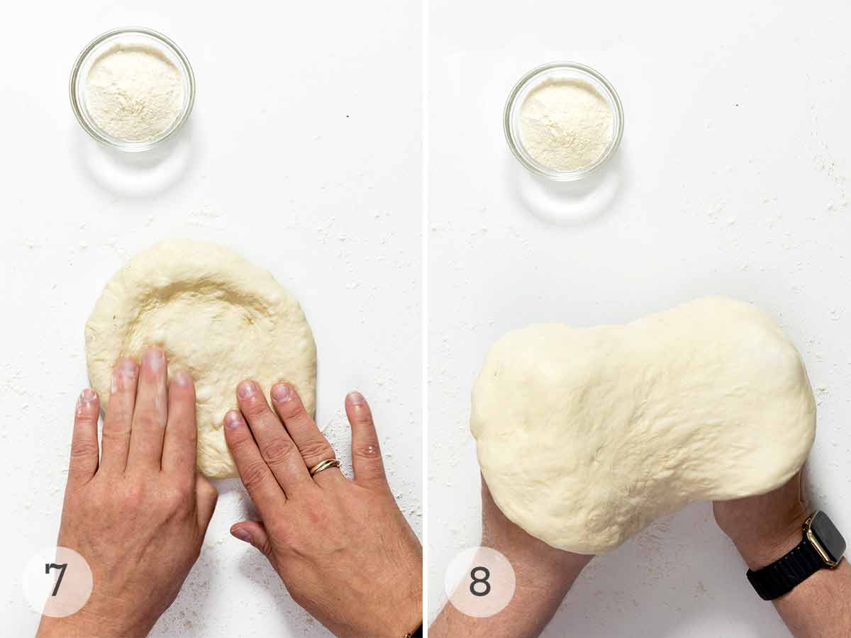 A person shaping and stretching a round of pizza dough with a small bowl of flour nearby.