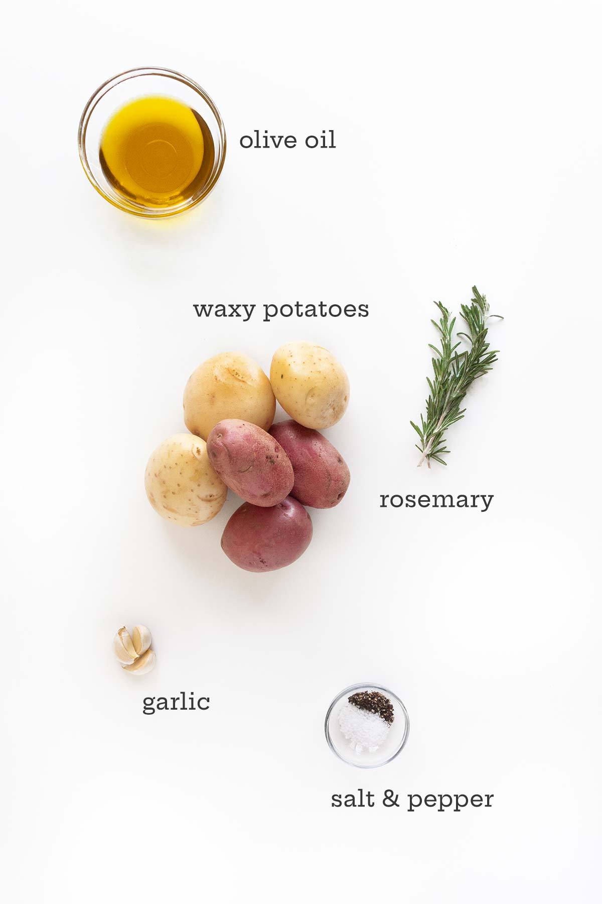Ingredients for roasted potatoes on the grill--waxy potatoes, oil, rosemary, garlic, and salt and pepper.