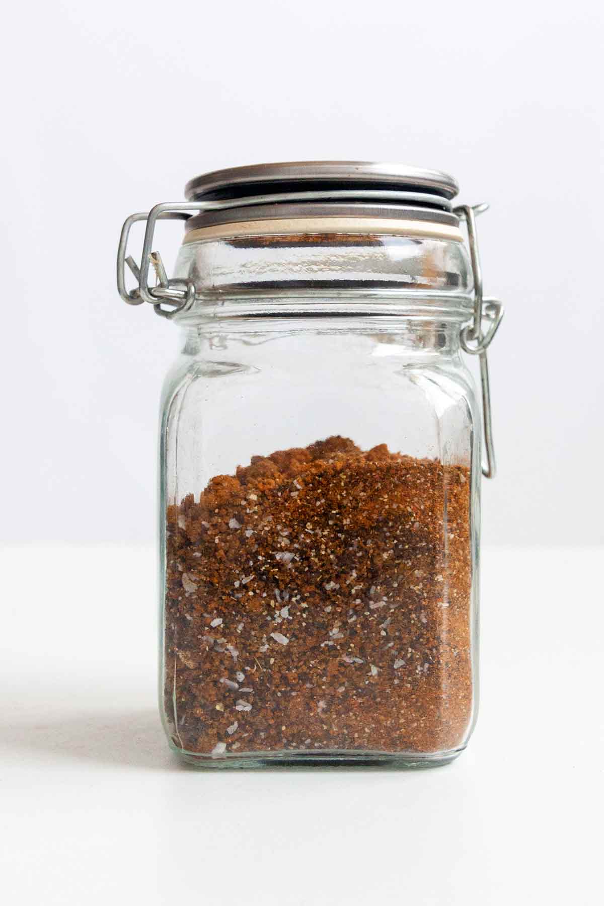 BBQ dry rub seasoning in a glass jar.