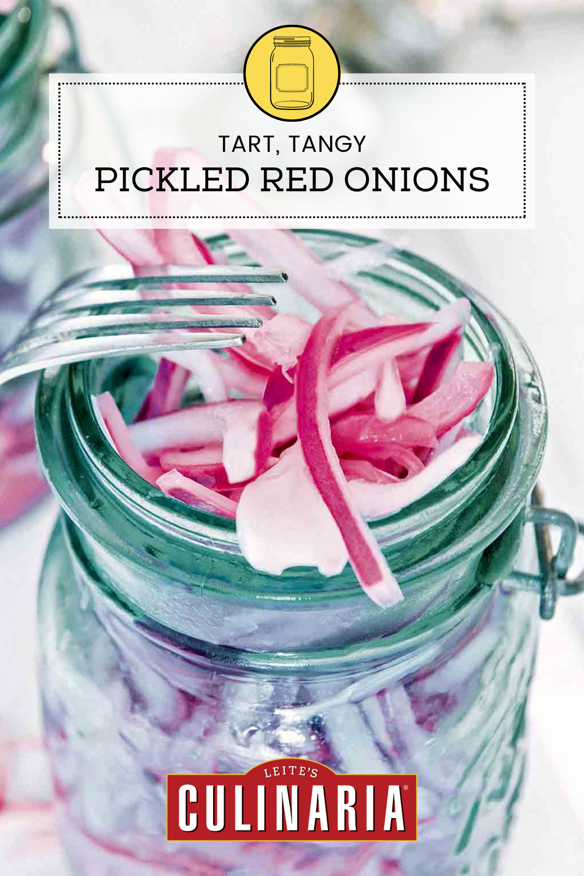 A canning jar overflowing with pickled red onions and a fork resting on the jar.