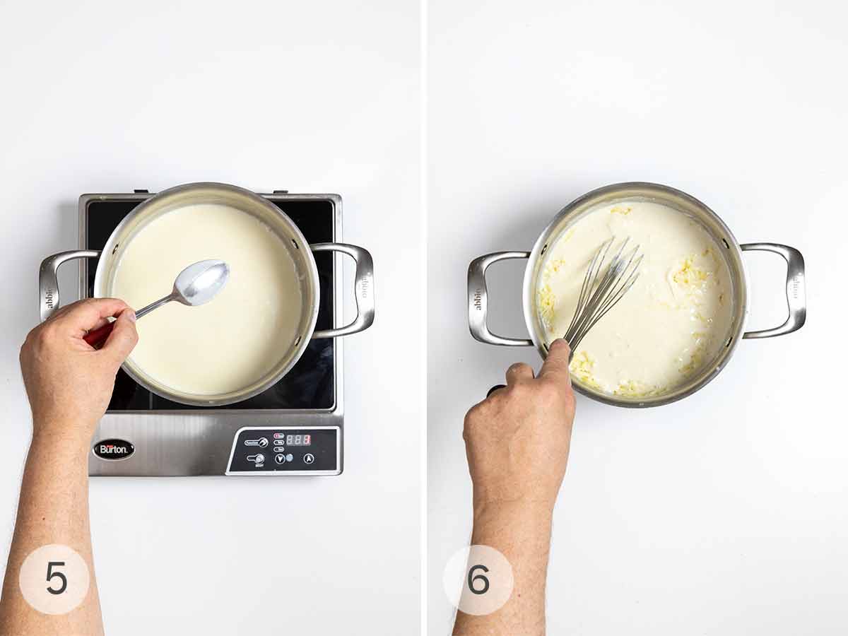 A man's hand holding a spoon over a pot of bechamel sauce; a man's hand whisking cheese into a pot of bechamel sauce.
