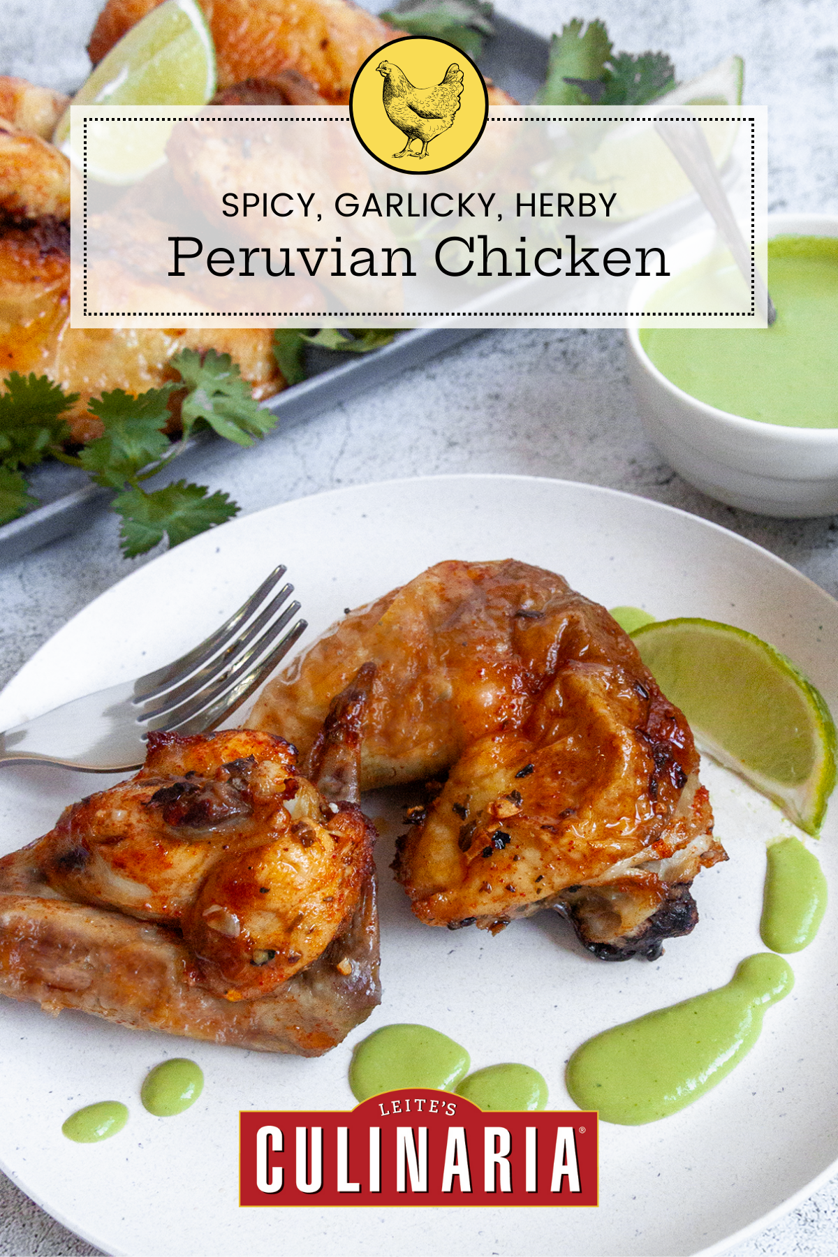 Two pieces of Peruvian chicken on a white plate with green sauce and a lime wedge.