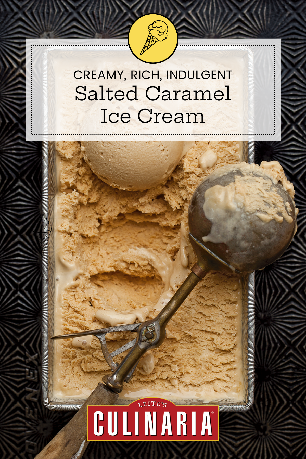Salted caramel ice cream in a loaf pan on a pattern baking sheet with a scoop and scooper on top.