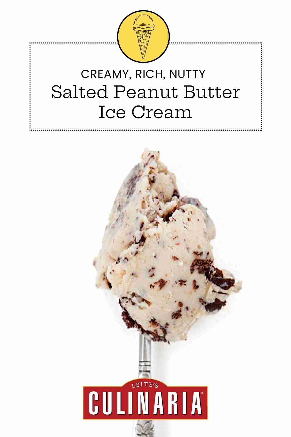 A scoop of salted peanut butter ice cream with chocolate flecks on a silver spoon.