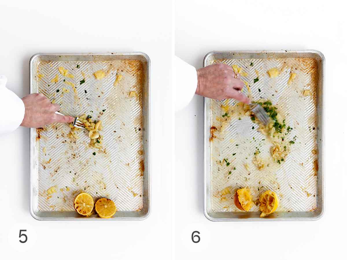 A person mashing roasted garlic into a sheet pan, then mixing it with liquid on the sheet pan.