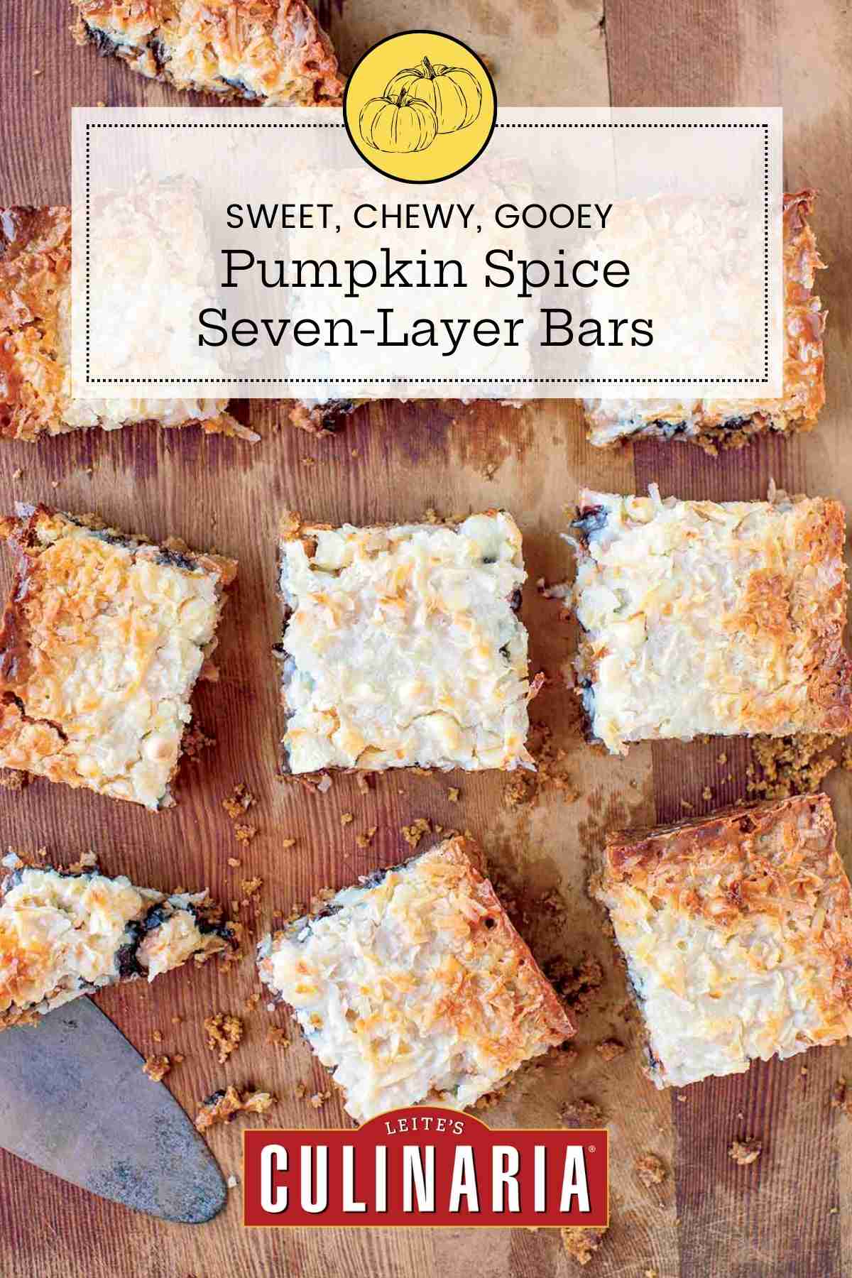 A slab of pumpkin spice seven layer bars cut into ten pieces on a wooden board.