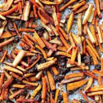 Roasted tzimmes on a large sheet pan.