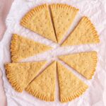 Eight pieces of Scottish shortbread on a crumpled piece of parchment paper.