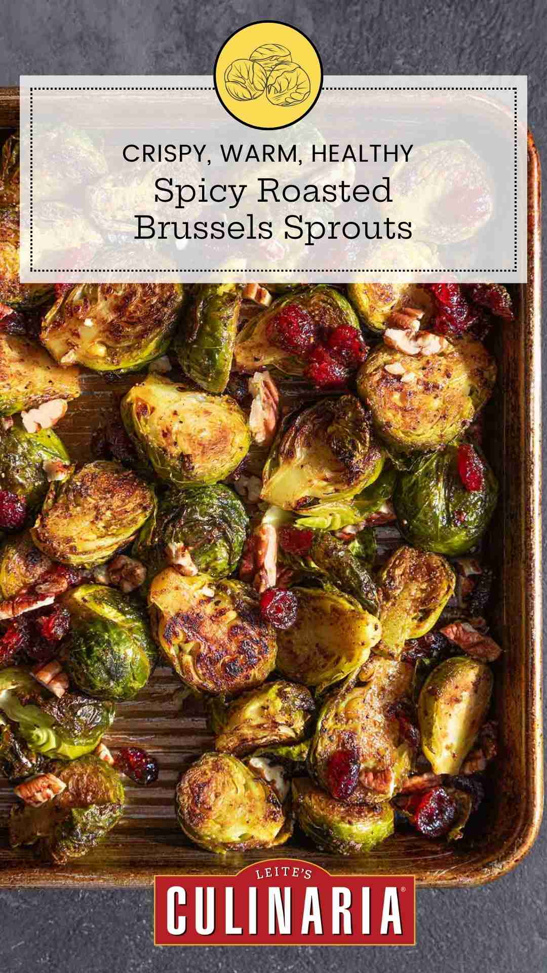 A tray of roasted Brussels sprouts with cranberries and pecans.