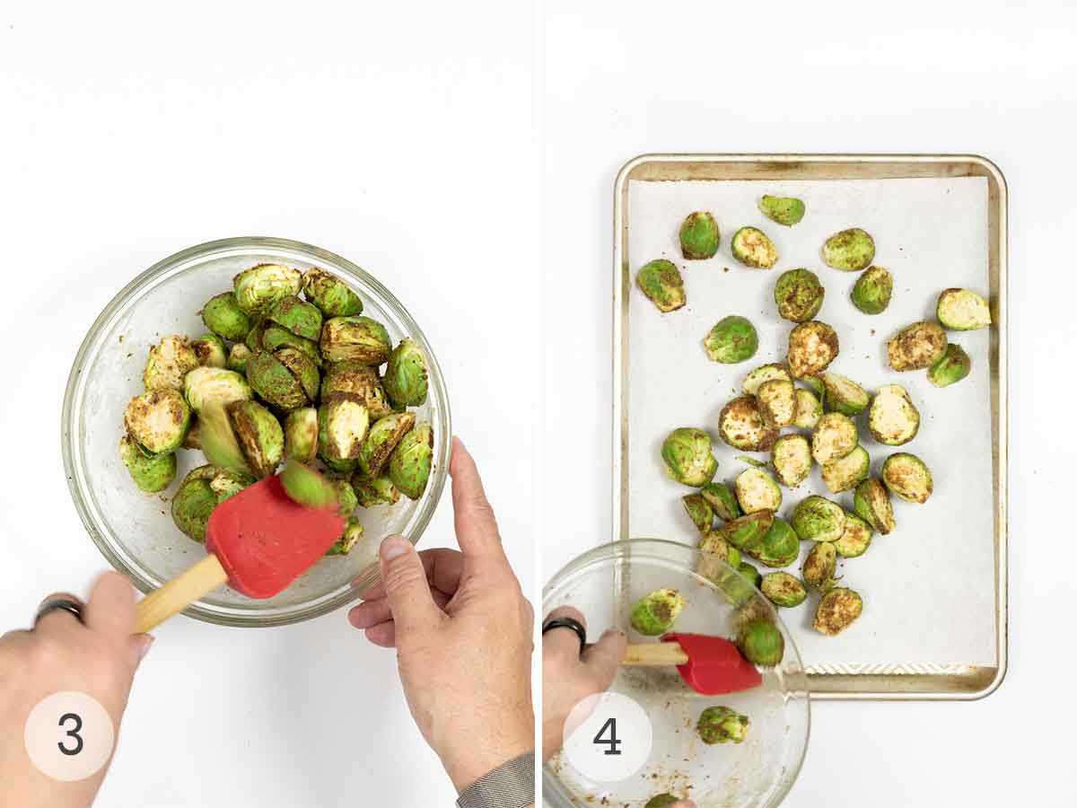 Halved Brussels sprouts being tossed with dressing and spread on a sheet pan.