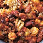 Chili mac and cheese in close up, with breadcrumbs and melted cheese.