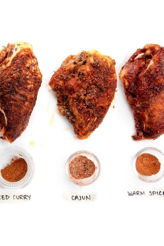 Three spiced roast chicken thighs, with warm spice, cajun, and spiced curry coatings.