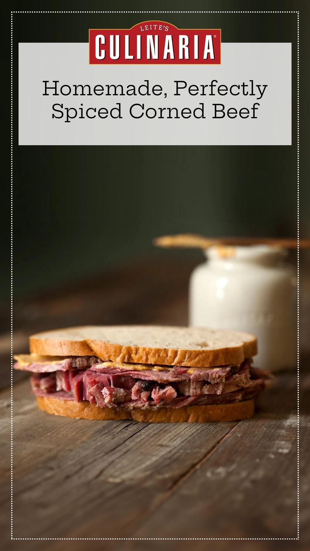 Several slices of homemade corned beef in a sandwich on a wooden table.
