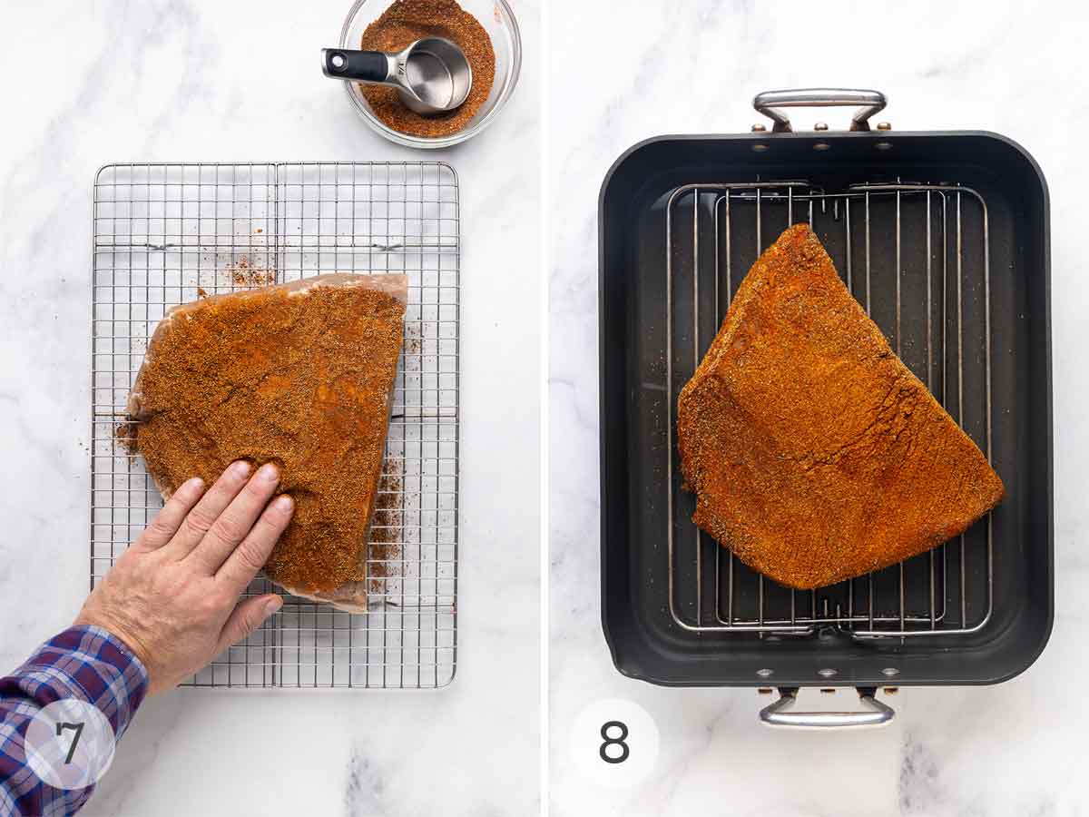 A person pressing a spice rub on a piece of brisket, then placing it on a rack in a roasting pan.
