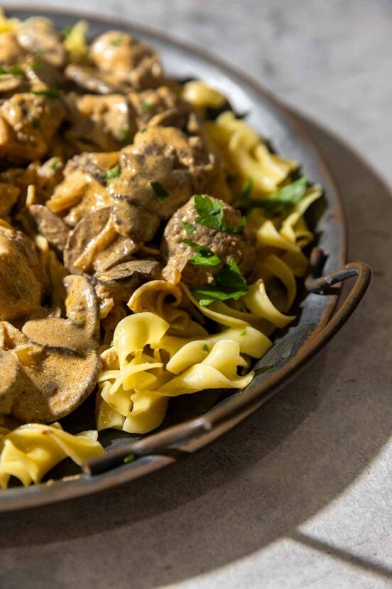A platter of meatball Stroganoff over buttered noodles.