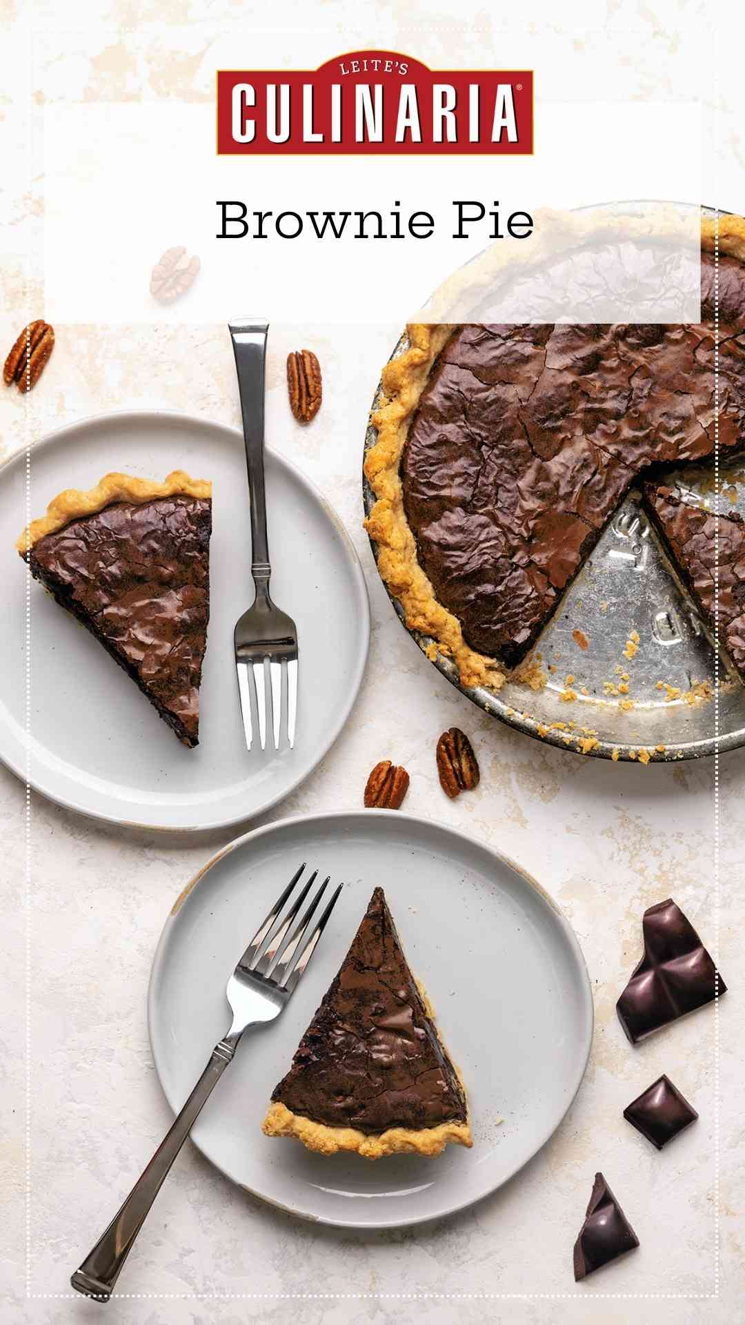 Two slices of brownie pie on plates with the remaining pie nearby.